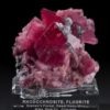 Rhodochrosite mineral specimen from Colorado on a custom made clear plastic lucite base by The Arkenstone