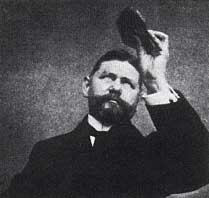 George Kunz with a crystal, thought to be a kunzite, in the early 1900s.
